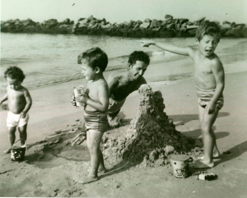 Woody with the kids on the beach at Coney Island, circa 1954. 